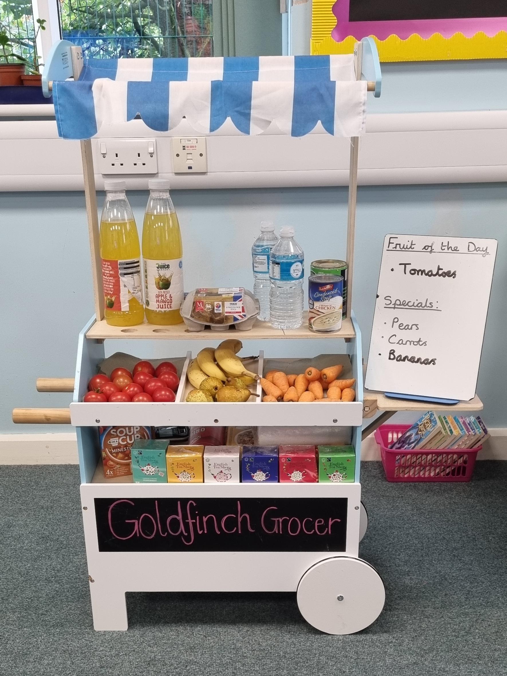 The children love getting their snack from the 'Goldfinch Grocer'. Only the fruit is eaten